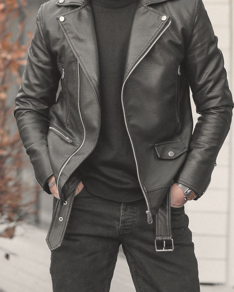 Black lambskin biker jacket with an asymmetric zip, worn open over a black knit