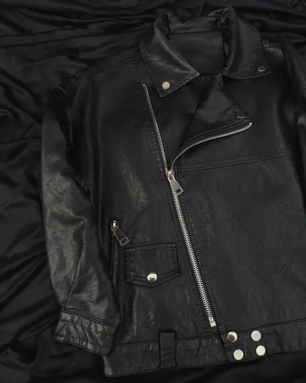 The Yangon Rider laid flat on black fabric, front view
